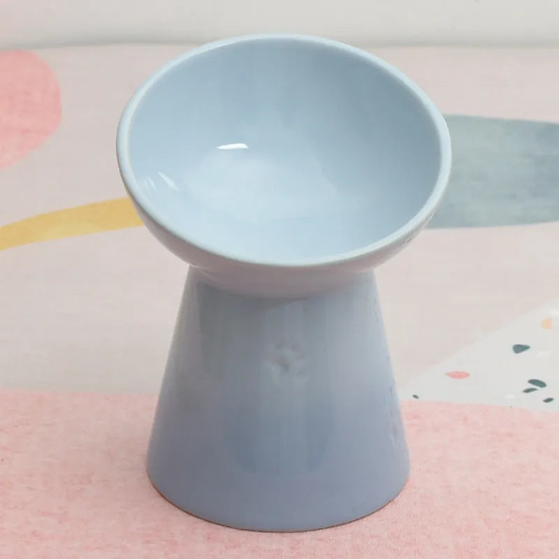 High-foot ceramic pet bowl with chin protector and anti-tumble base design