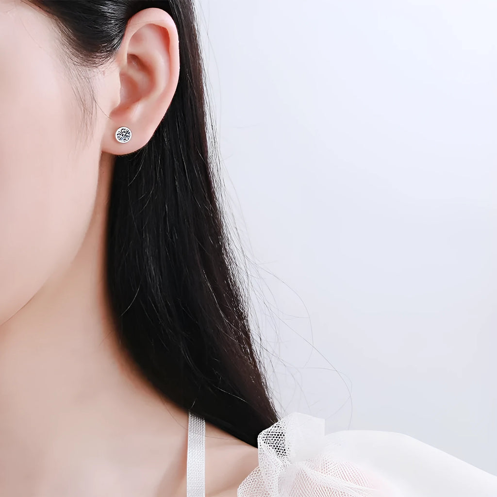 Pair of 925 sterling silver gold plated stud earrings featuring geometric moissanite or zircon stones in golden toad or star shape.