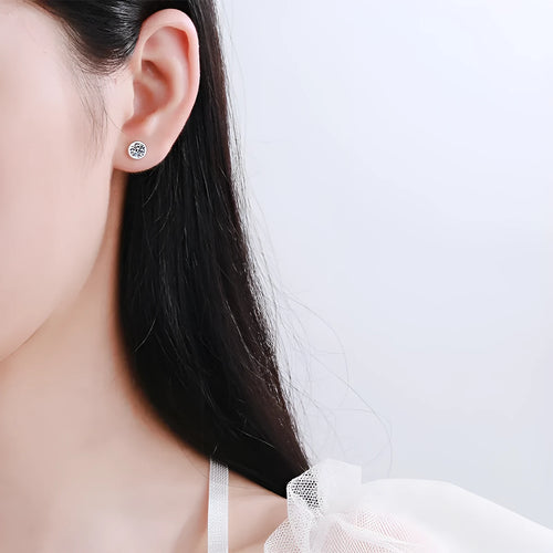 Pair of 925 sterling silver gold plated stud earrings featuring geometric moissanite or zircon stones in golden toad or star shape.