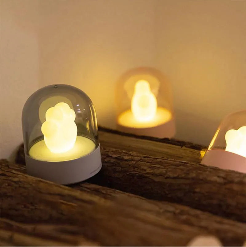 Grey and pink cat paw shaped USB rechargeable night light with musical functions