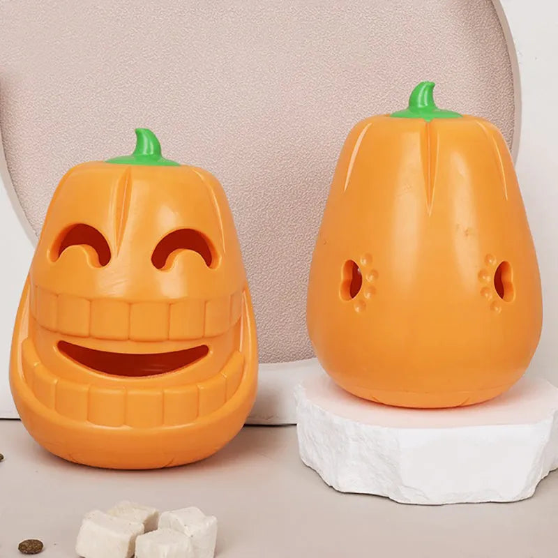 Orange Halloween pumpkin shaped dog chew toy with treat-dispensing funnel opening