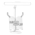 Adjustable desk lamp with integrated bookshelf showing three colour temperature settings and USB charging port