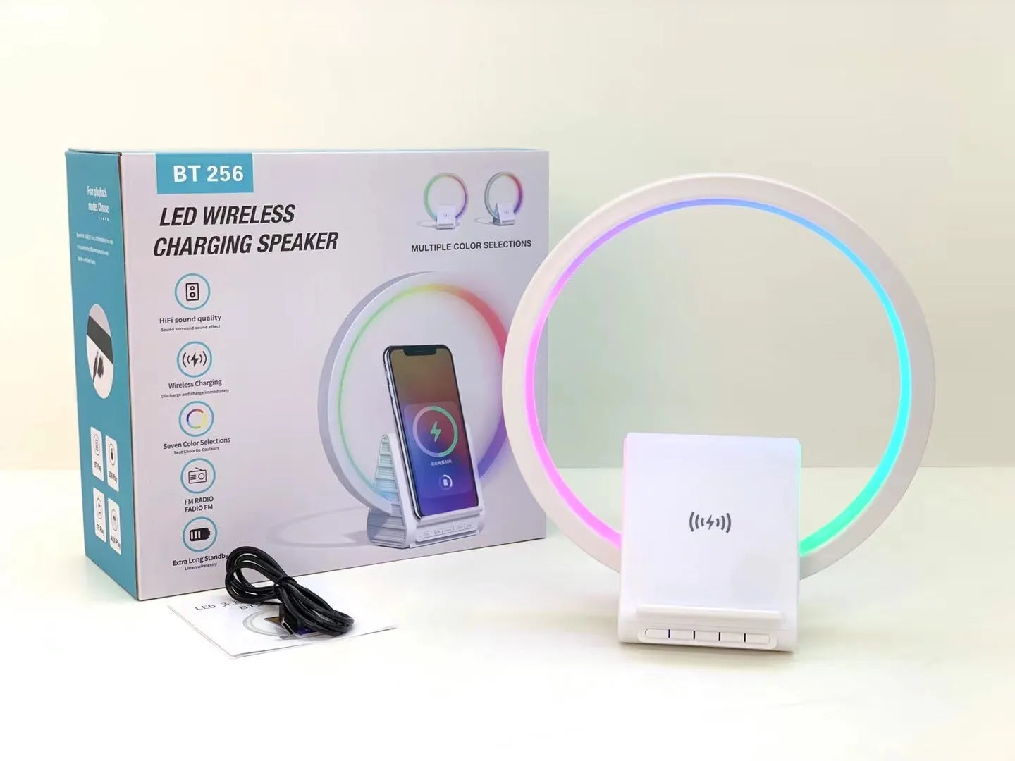 White circular Bluetooth speaker with wireless charging surface measuring 225mm diameter