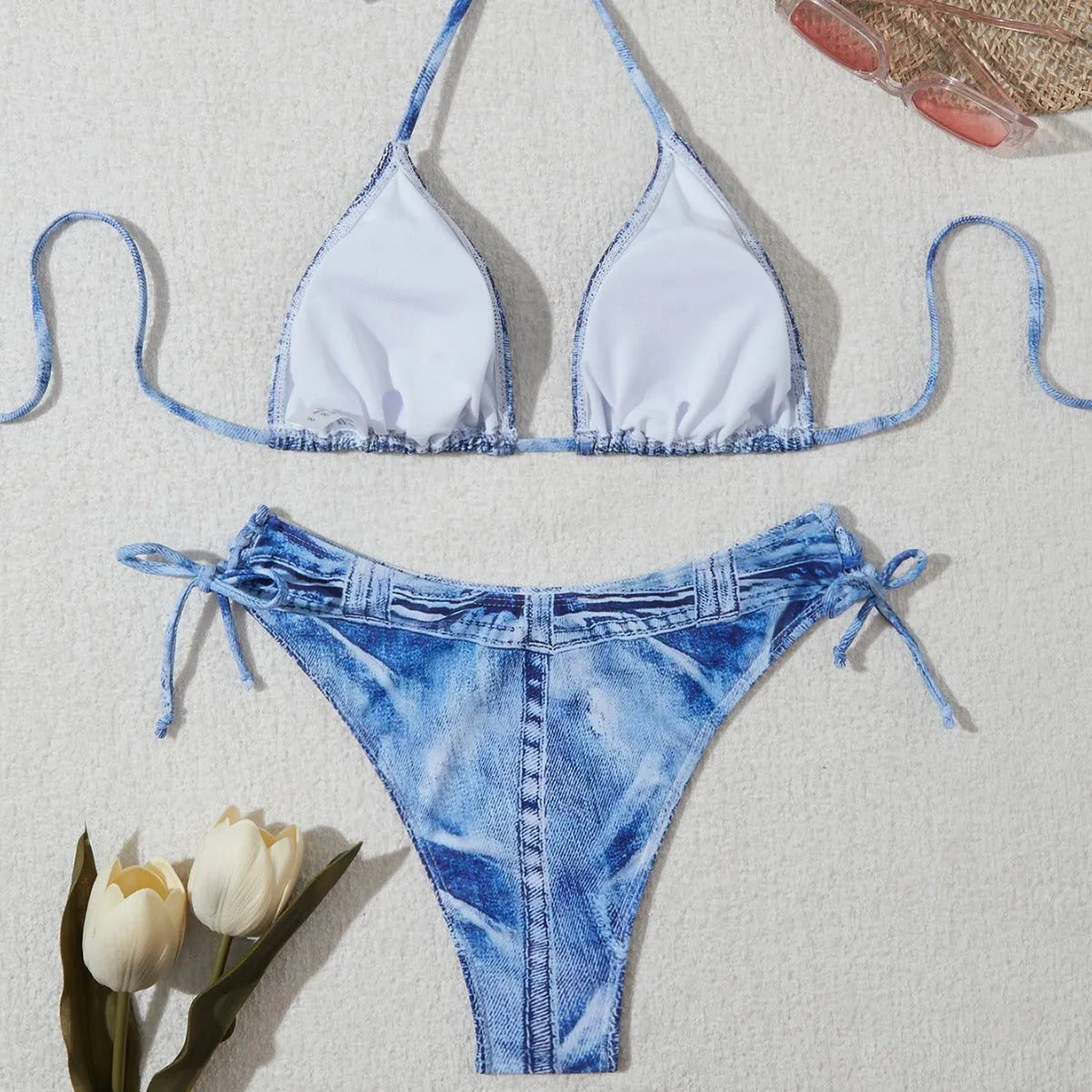 Women's denim blue printed bikini set with adjustable straps, shown as a two-piece swimsuit.