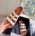 Women's retro Roman style sandal slippers in patent leather finish with adjustable ankle straps.