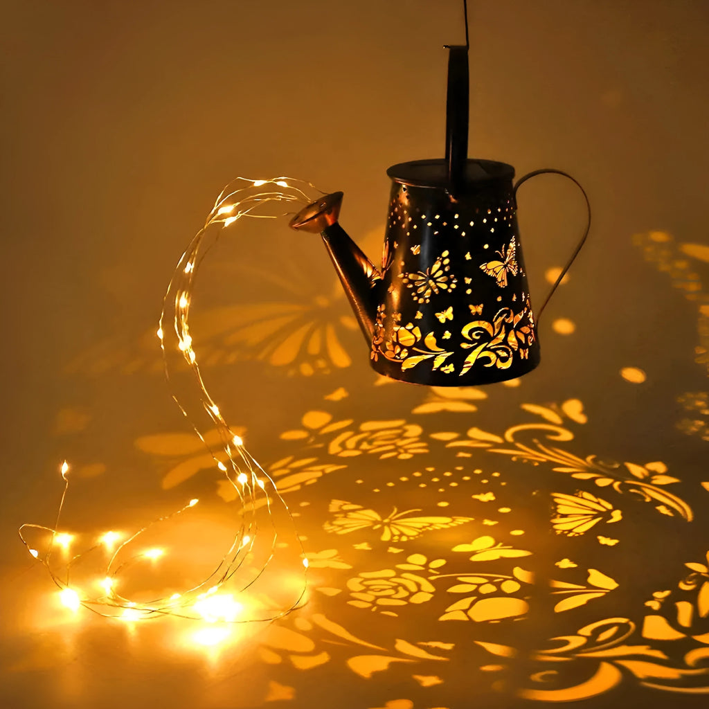 Solar-powered iron butterfly garden lamp with tapered silhouette and warm white LED light