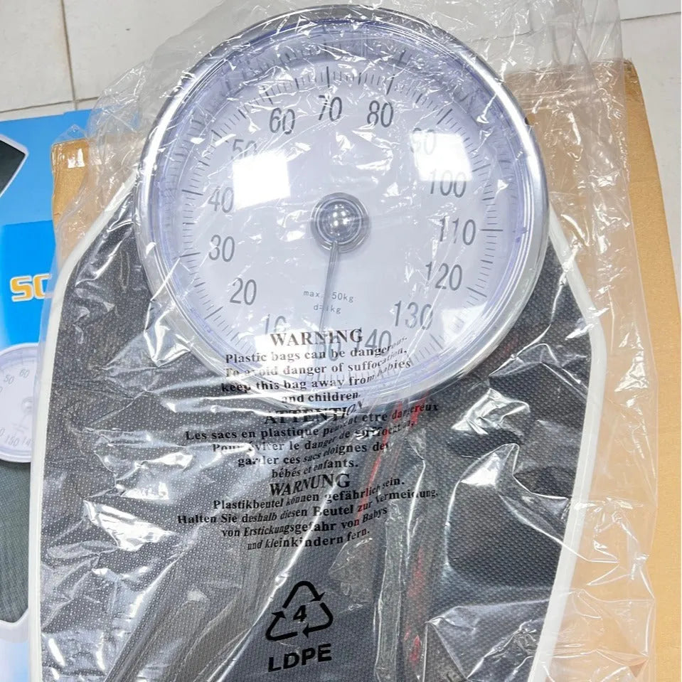 Black mechanical pointer body weight scale with large dial on a 47x35x11cm platform.