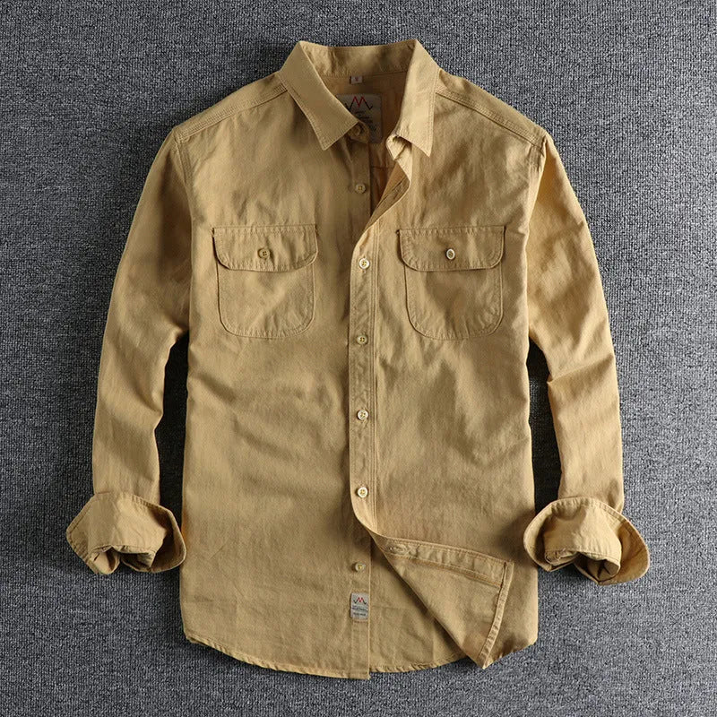 Men's light blue cotton long sleeve cardigan-style shirt on a hanger.