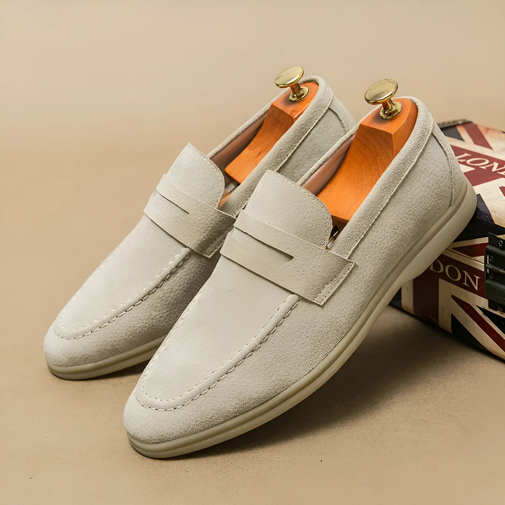 Men's black slip-on leather casual shoes with round toe and a mid-height rubber sole.