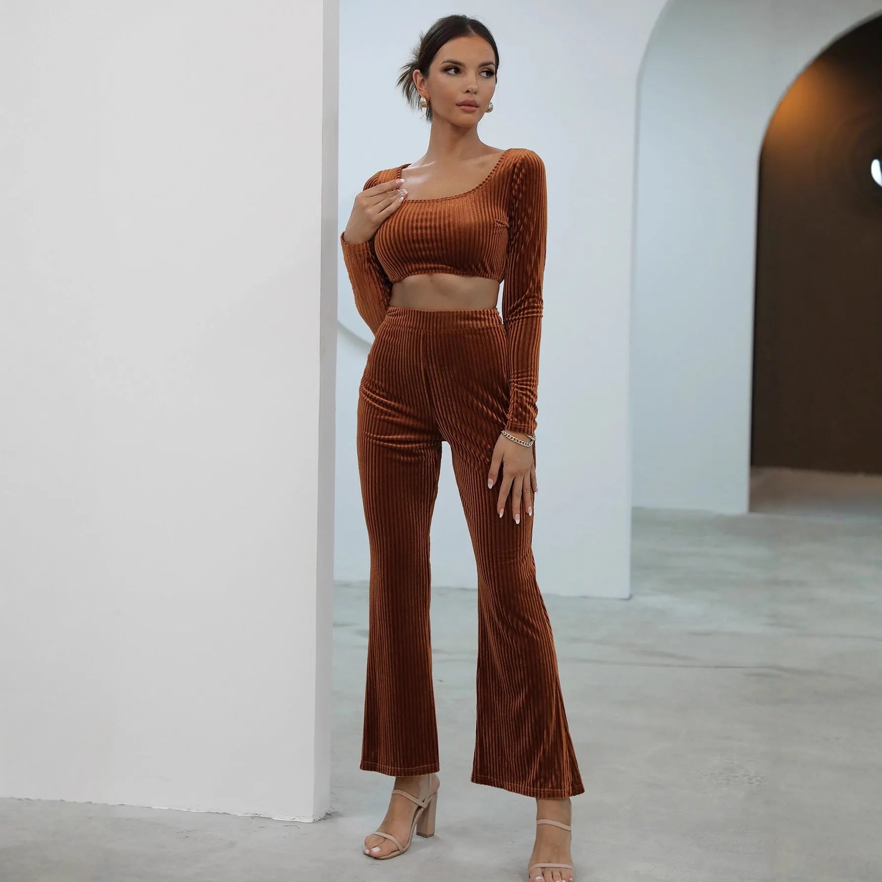 Caramel coloured long sleeve sweater set with matching trousers on hanger
