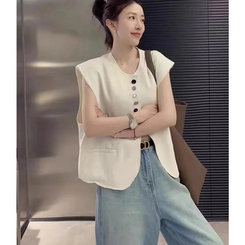 Women's loose fit polyester vest in milky white colour with front pocket