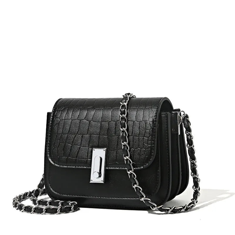 Women's black PU leather chain shoulder bag showing internal phone compartment and sewing thread detailing