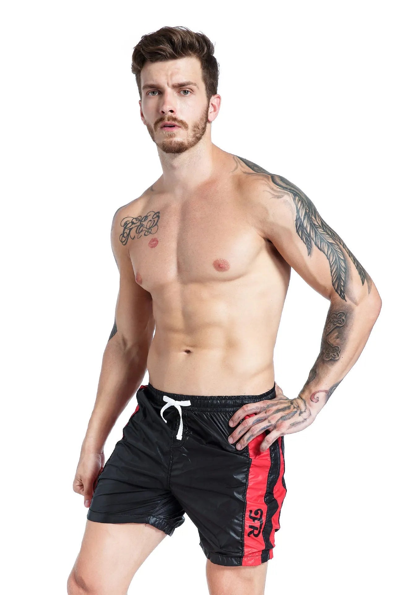 Men's blue polyester sports shorts with lace-up front and slim fit, shown on a hanger.