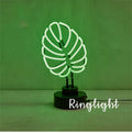 White tube bamboo shape desktop lamp emitting green light with USB cable