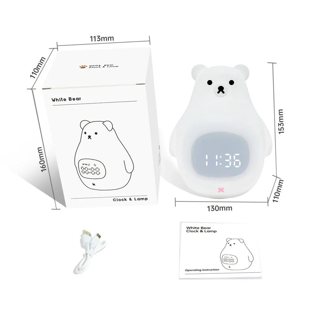 White silicone cartoon bear night light with remote control on a table.