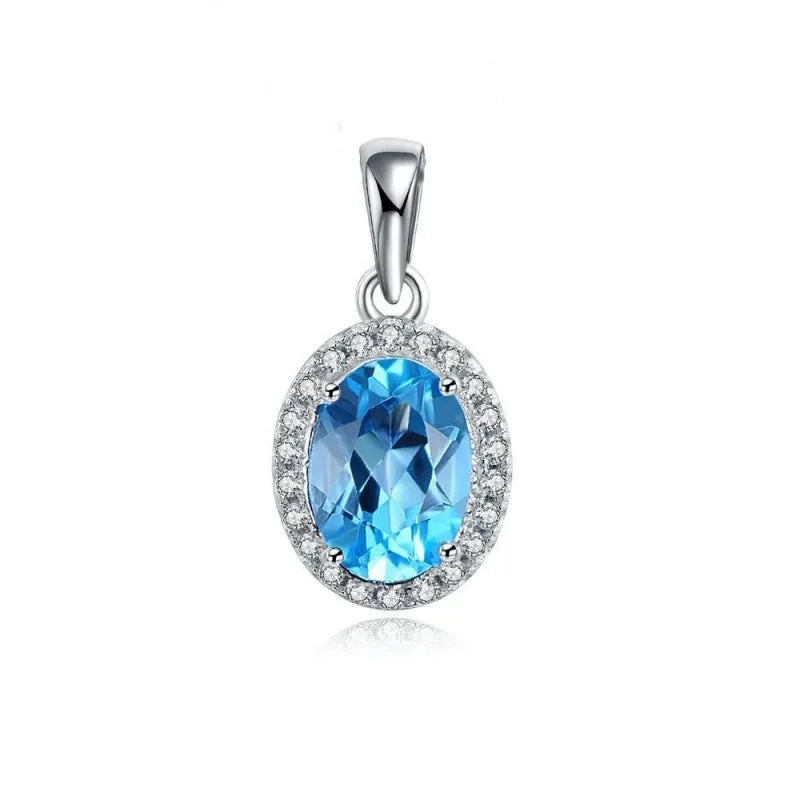 925 sterling silver jewellery set with blue topaz gemstones showing geometric design earrings, ring, pendant, and necklace