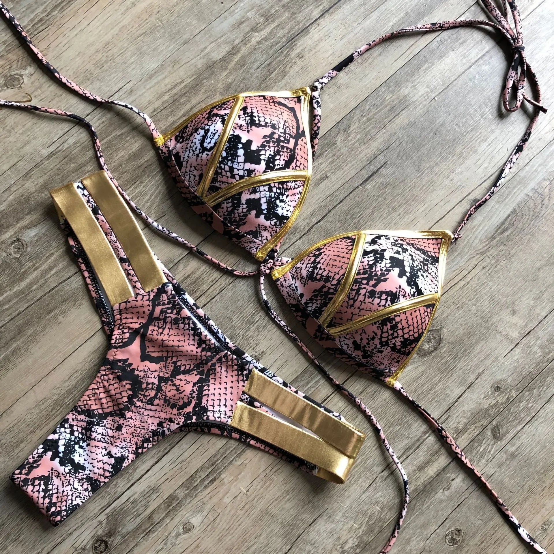 Women's bronzing bikini top and bottom set in leopard print with non-wired triangle cups.