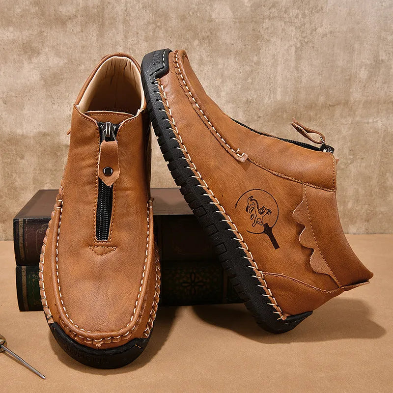 Men's solid colour slip-on loafers with round toe and rubber sole, shown in black, brown, and grey.