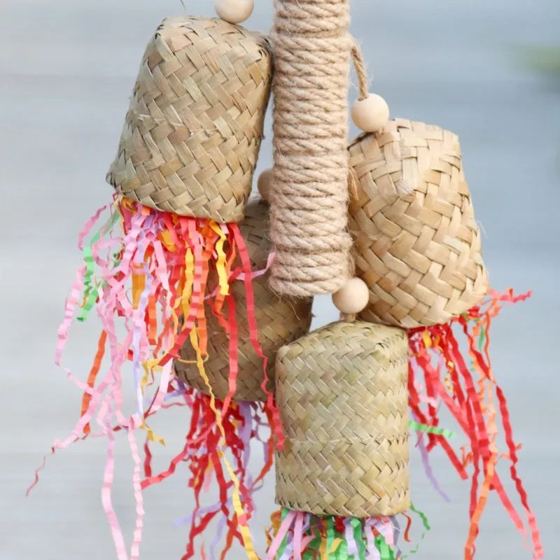 Wood and sisal parrot toy with colourful shredded paper measuring 15cm by 35cm