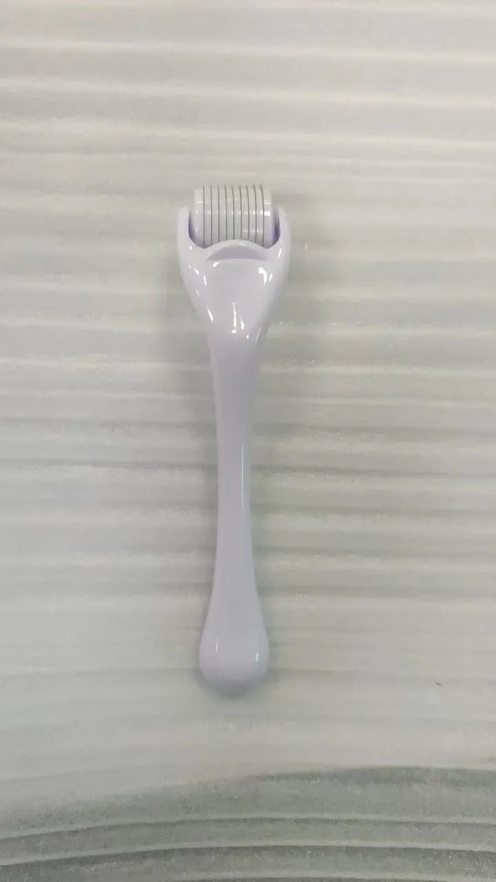 Professional 540 needle dermaroller for mechanical font with coloured handle and wheel, showing sterile stainless steel needles.