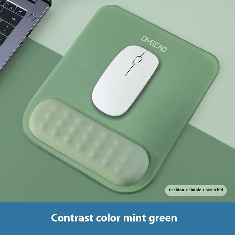 Ergonomic mouse pad with raised wrist support in cloth silicone material showing colour options