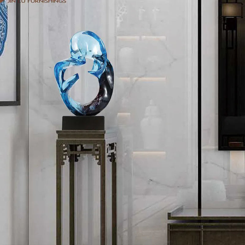 Transparent resin ornament in modern style available in blue or orange red colour