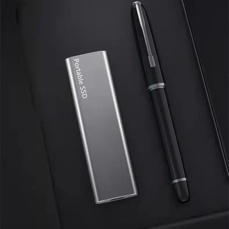 Portable mobile SSD hard drive with metal casing and ultra-thin design in red colour
