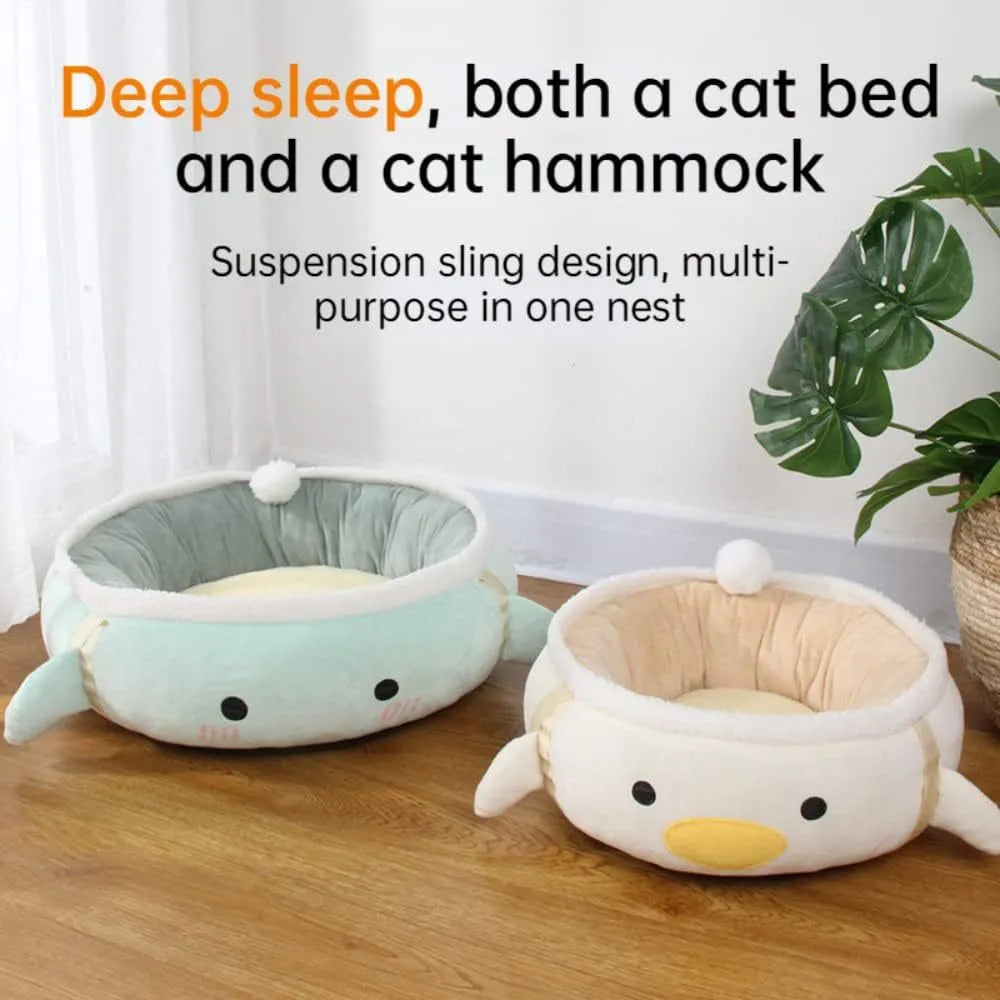 Green dinosaur and chick shaped cat bed that can be used flat or hung as a hammock