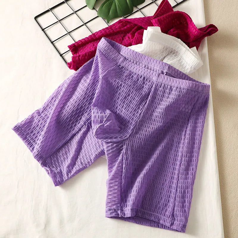 Men's solid colour lace boxer shorts with a hip-lifting fit on a size chart.