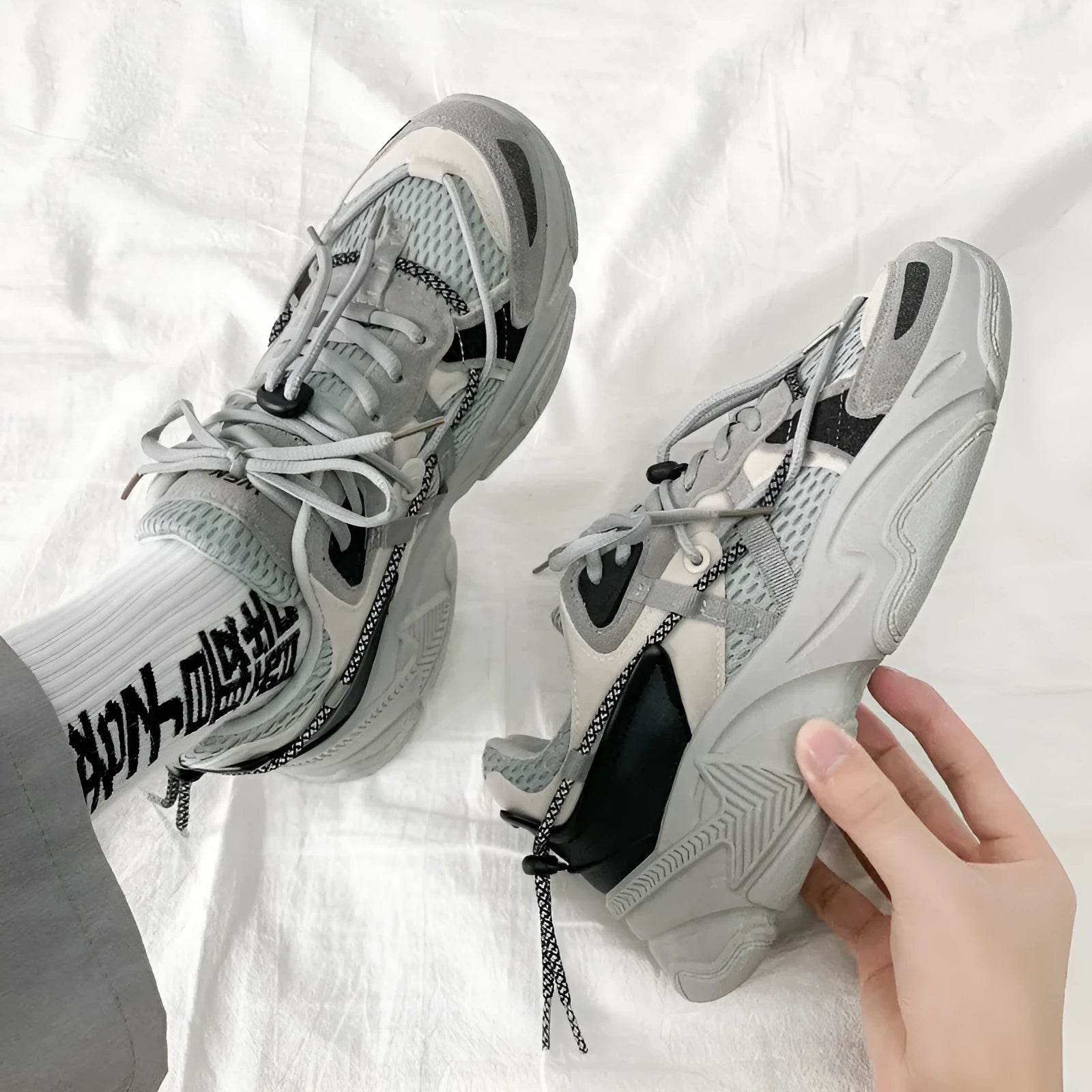 Men's white Korean style platform sneakers with lace-up front on a neutral background.