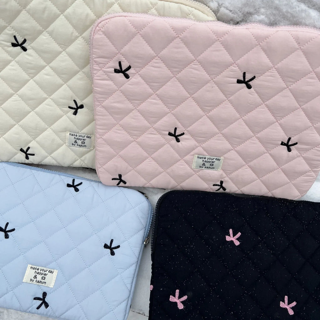 Laptop storage bag with rhombus embroidered bow decoration in nylon material showing colour options
