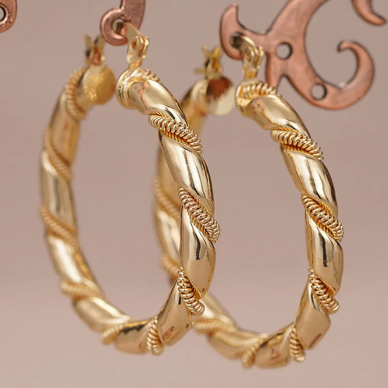 Geometric copper earrings with ring and line design in golden colour