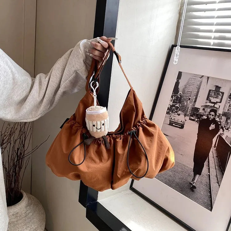 Ultra-light pleated crossbody student bag in polyester with folding design and internal phone pocket