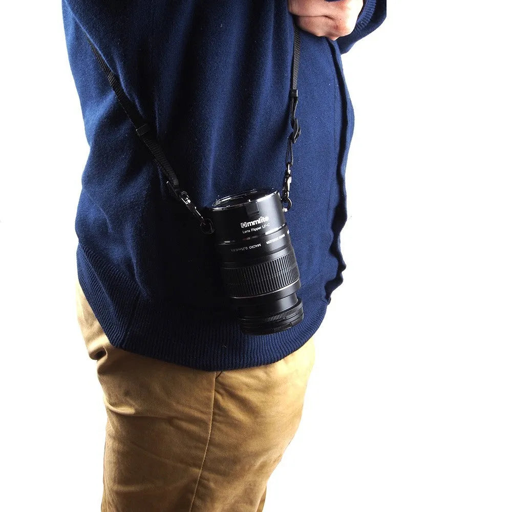 Aluminium camera lens flipper holder with cotton strap for quick lens changes on DSLR.