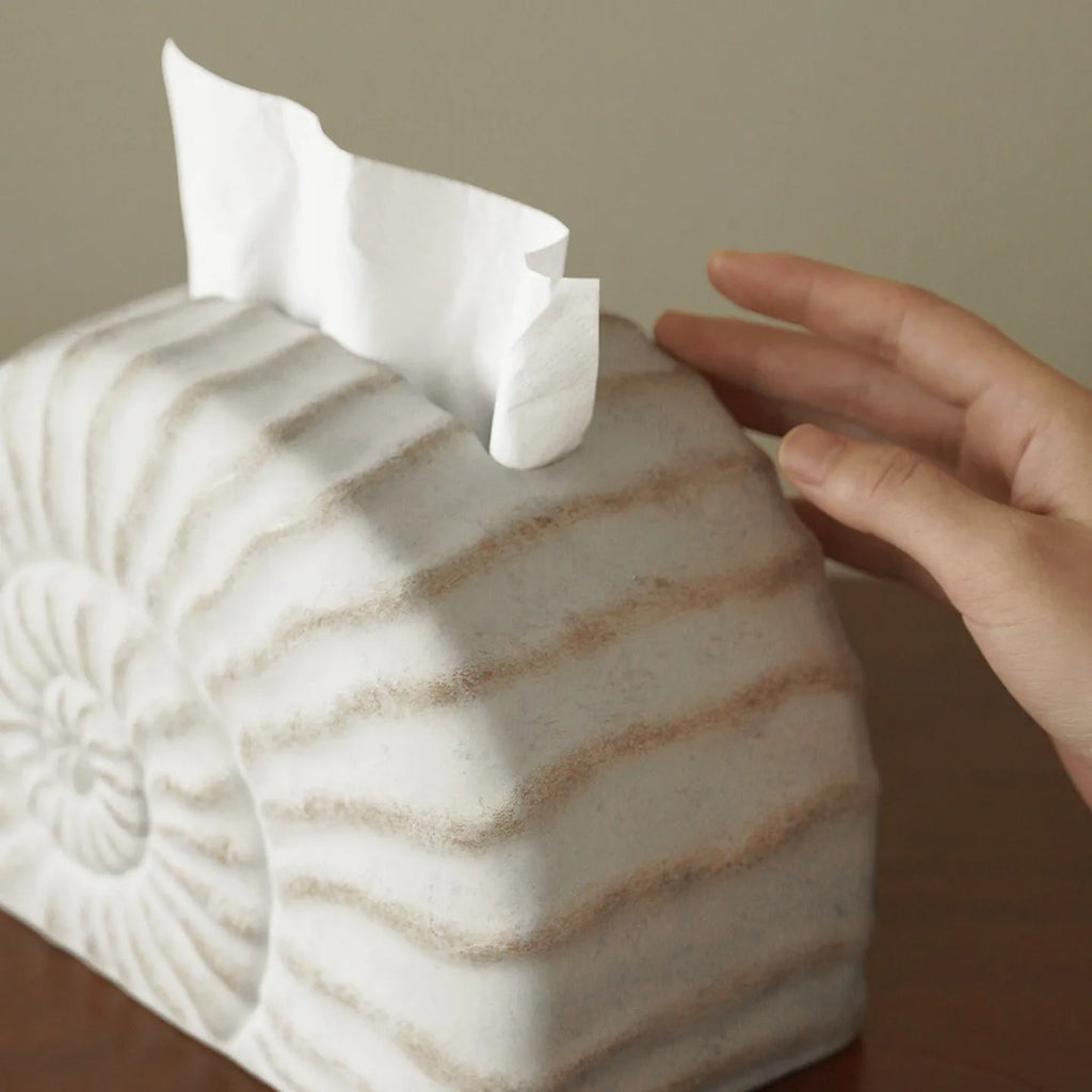 Modern simple resin tissue box cover with decorative conch ramble pattern.