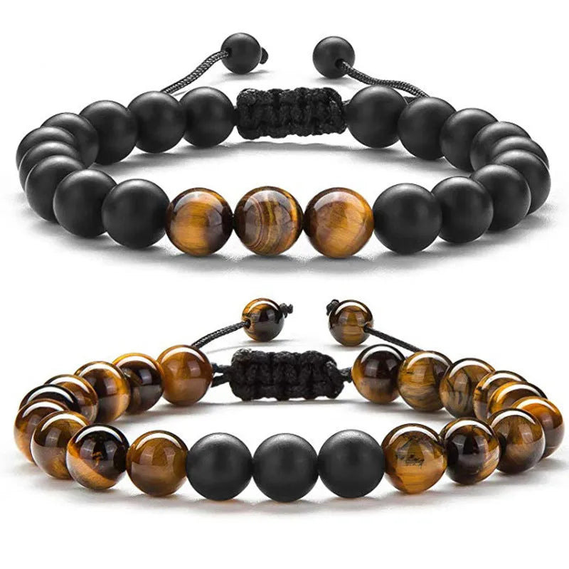 Matte black agate tiger eye bead couple bracelets with geometric design on a neutral background.