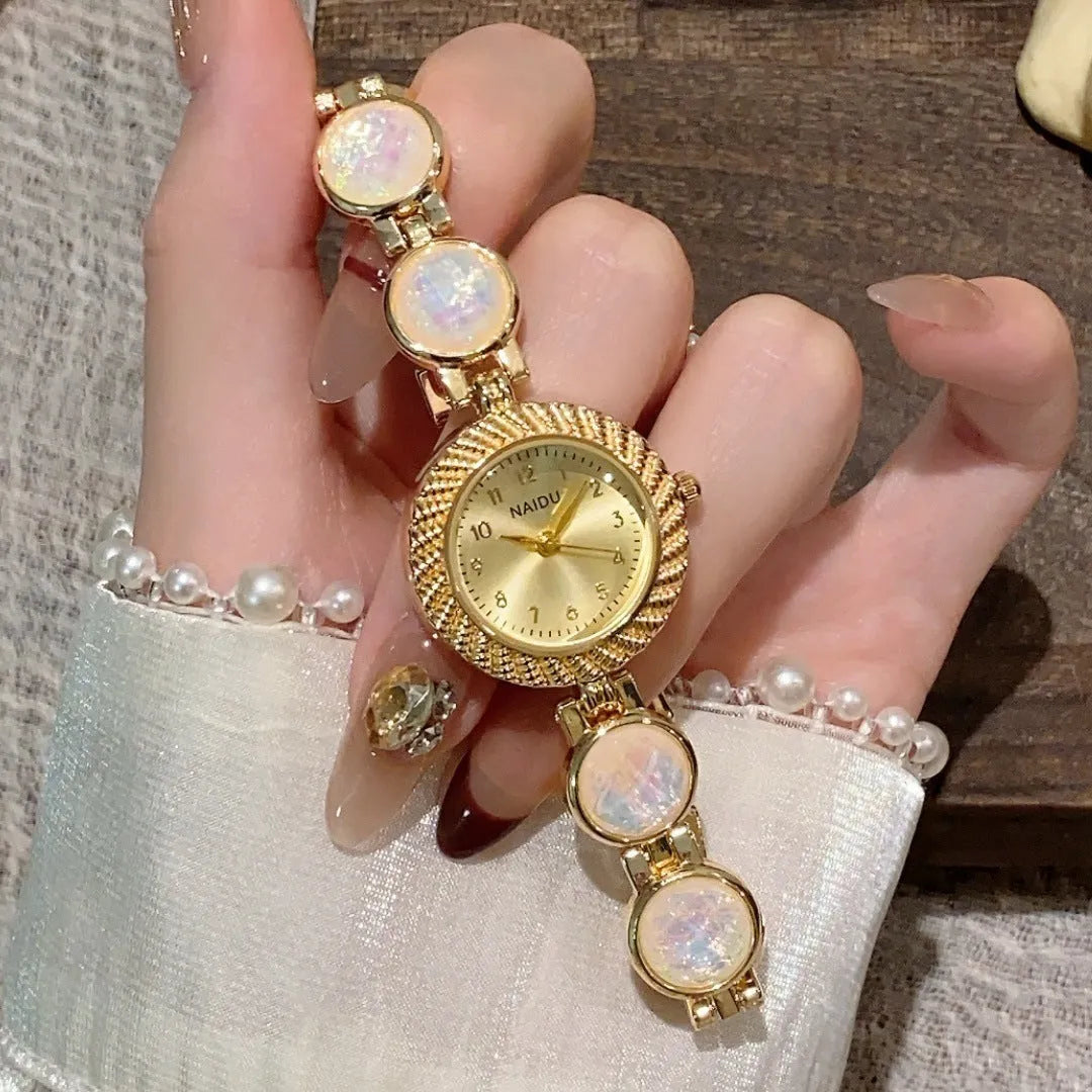 Women's quartz watch with 25mm round dial in zinc alloy case showing spiral crown and colour options