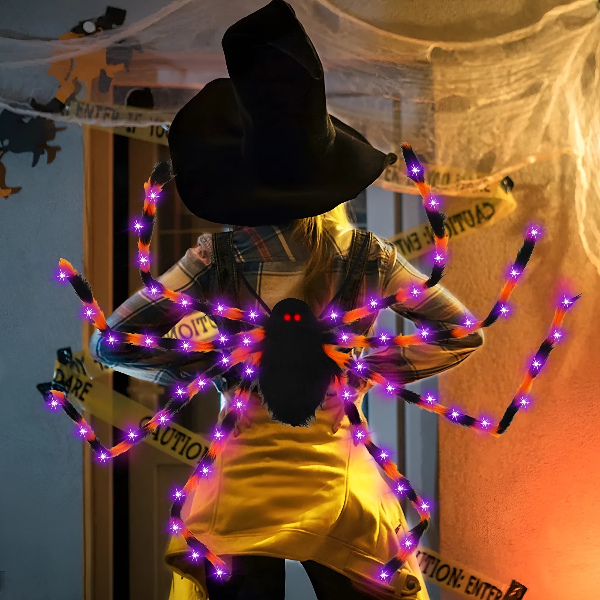 Halloween spider backpack with LED lights in plush sugar bag design shown in orange purple light colour