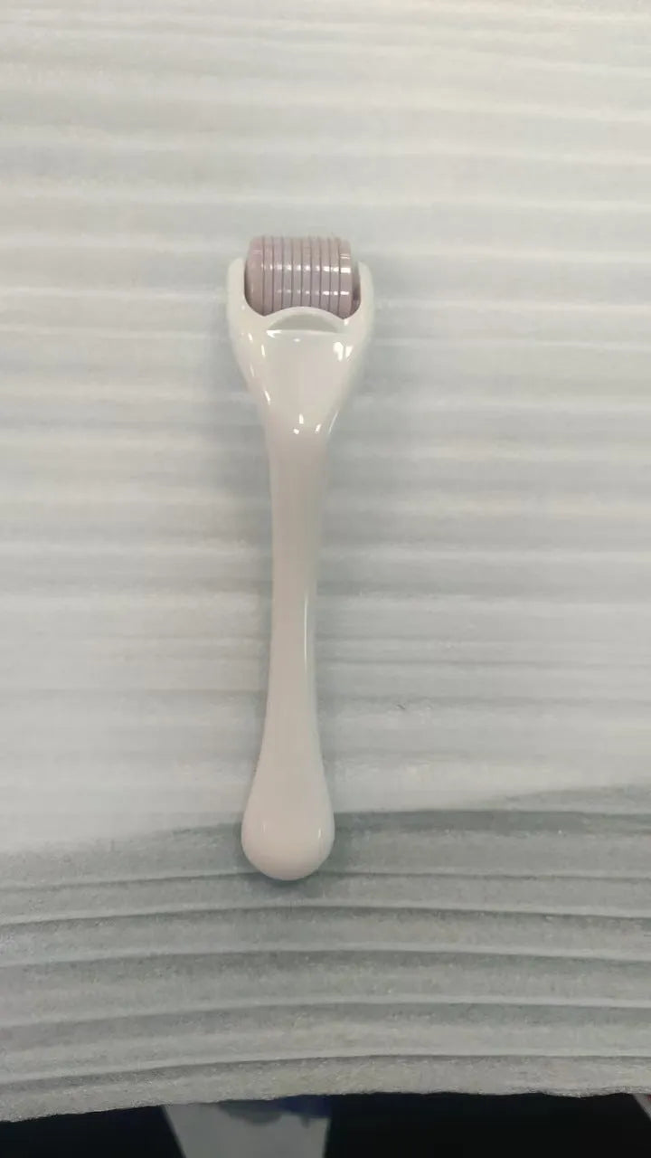 Professional 540 needle dermaroller for mechanical font with coloured handle and wheel, showing sterile stainless steel needles.