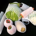 White foam net fruit protective cover shown in various sizes for packing.