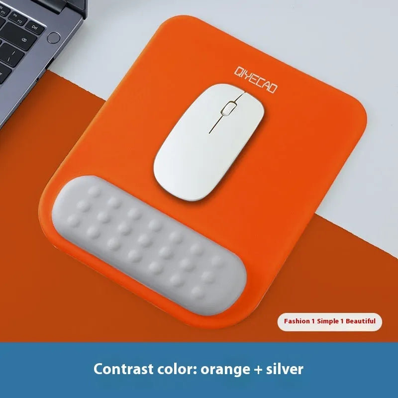 Ergonomic mouse pad with raised wrist support in cloth silicone material showing colour options