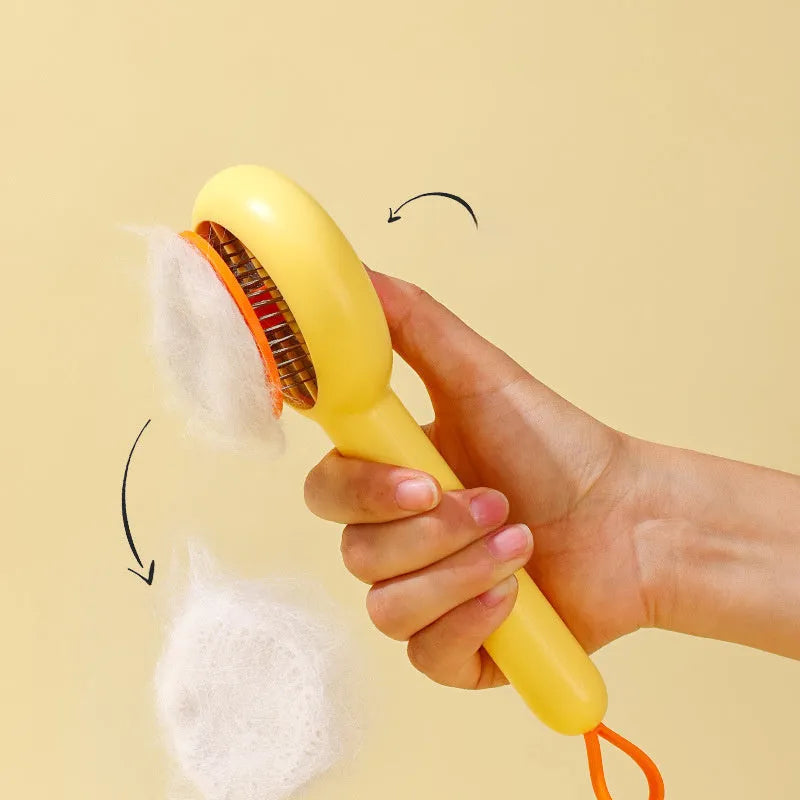 Small yellow duck-shaped pet comb with needle teeth for cat and dog grooming