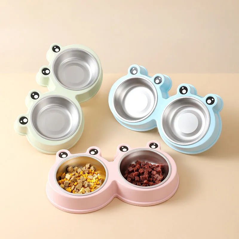 Blue stainless steel double bowl pet feeder with frog-shaped centrepiece for cat or dog food and water.