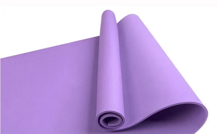 EVA fitness yoga mat in blue, showing its texture and thickness, rolled up with its OPP storage bag.