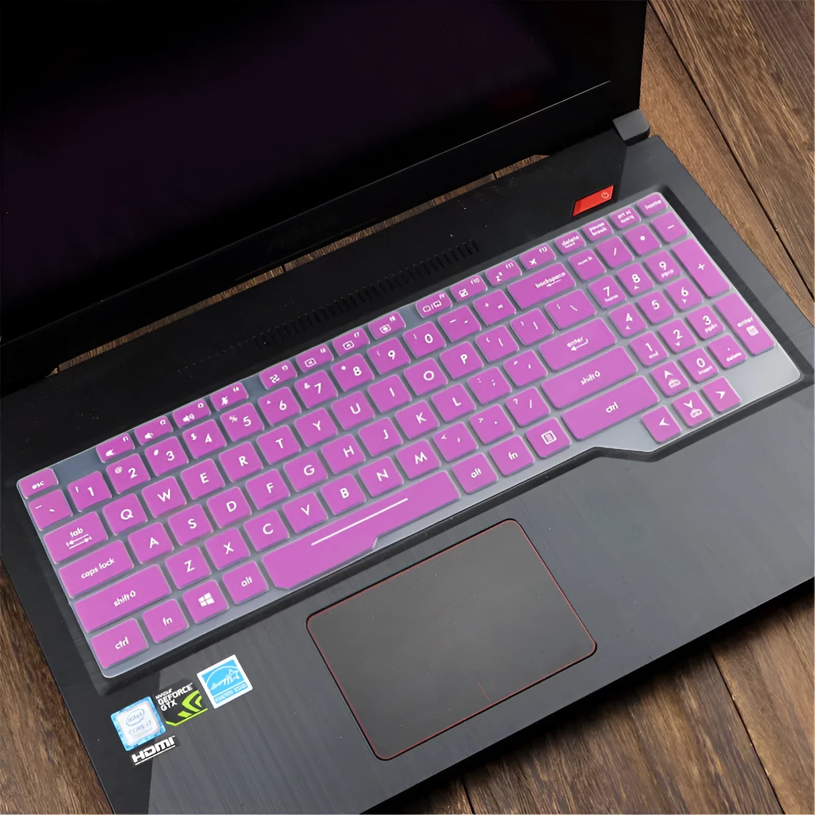 ASUS Flight laptop keyboard protective film cover shown in a translucent colour option on a laptop.