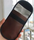 Black microfiber Faraday cage bag for blocking car key and phone signals, measuring 13.5 by 9.5 cm.