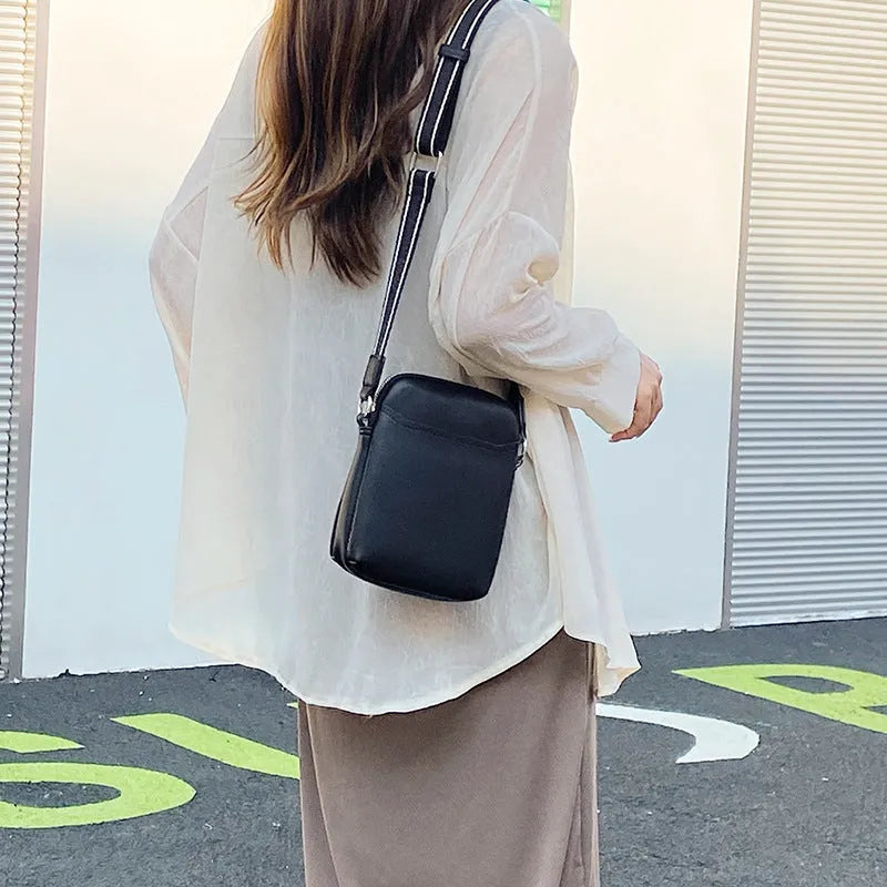 Solid colour PU mobile phone crossbody shoulder bag in black, beige, khaki, or green.
