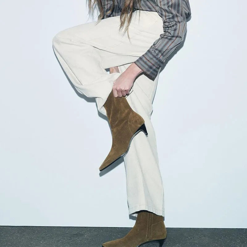 Brown women's square toe ankle boots with a side zip and a mid-height stiletto heel.