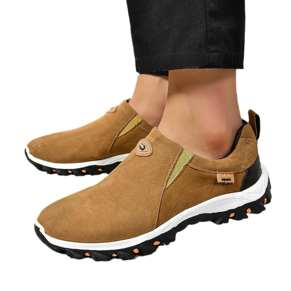 Men's thin grey overshoe cover with round toe and rubber sole, shown on a shoe.