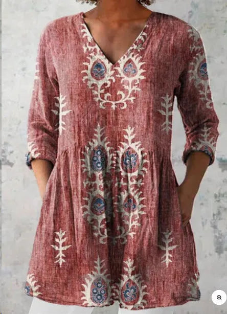 Women's floral printed loose dress with wide waist and three-quarter sleeves on a hanger.